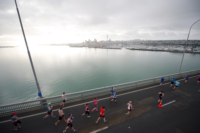 Runners crossing the Harbour Bridge running the Auckland Marathon