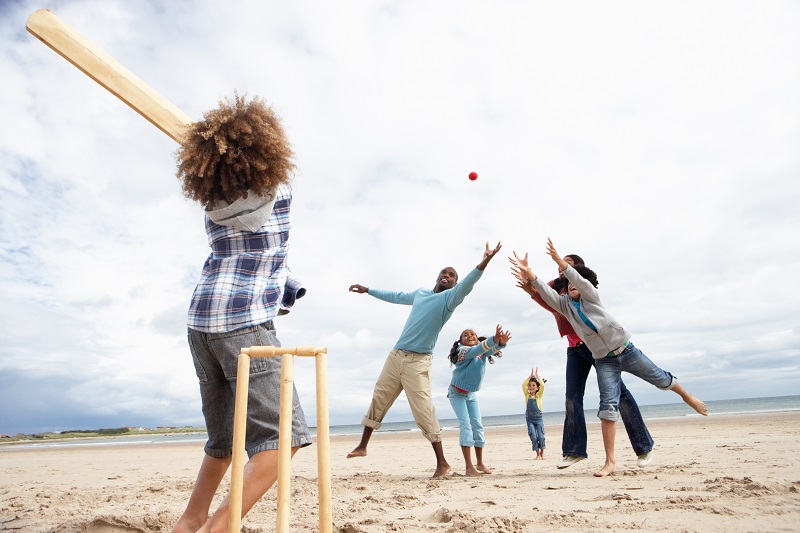 Playing cricket on the beach on Christmas Day in New Zealand