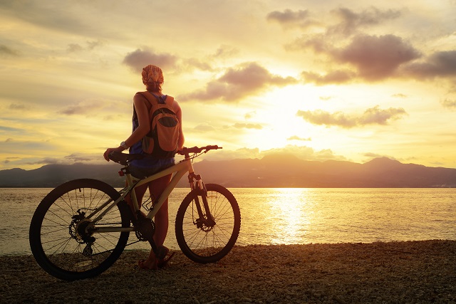 Image of a woman Cycling the Queen Charlotte Track