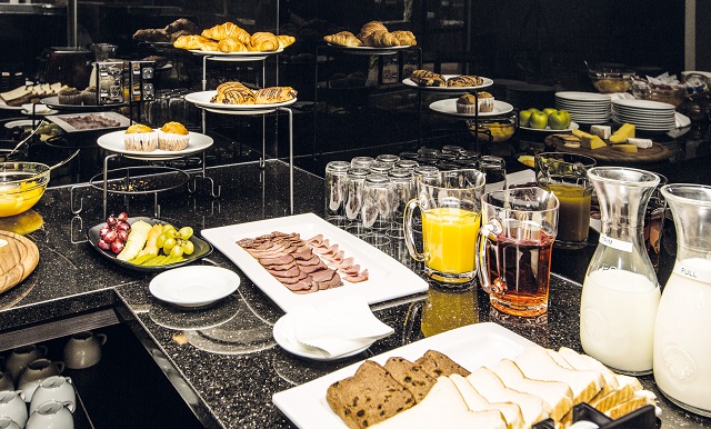 Image of a breakfast table laid out with a continental brekfast selection at Greenlane Suites