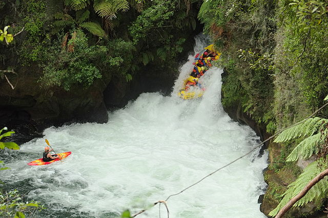 White water rafters flying down Okere Falls