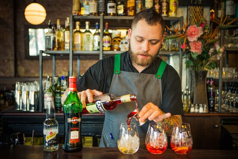 One of the expert Mixologists working his cocktail magic at Visa Wellington on a Plate