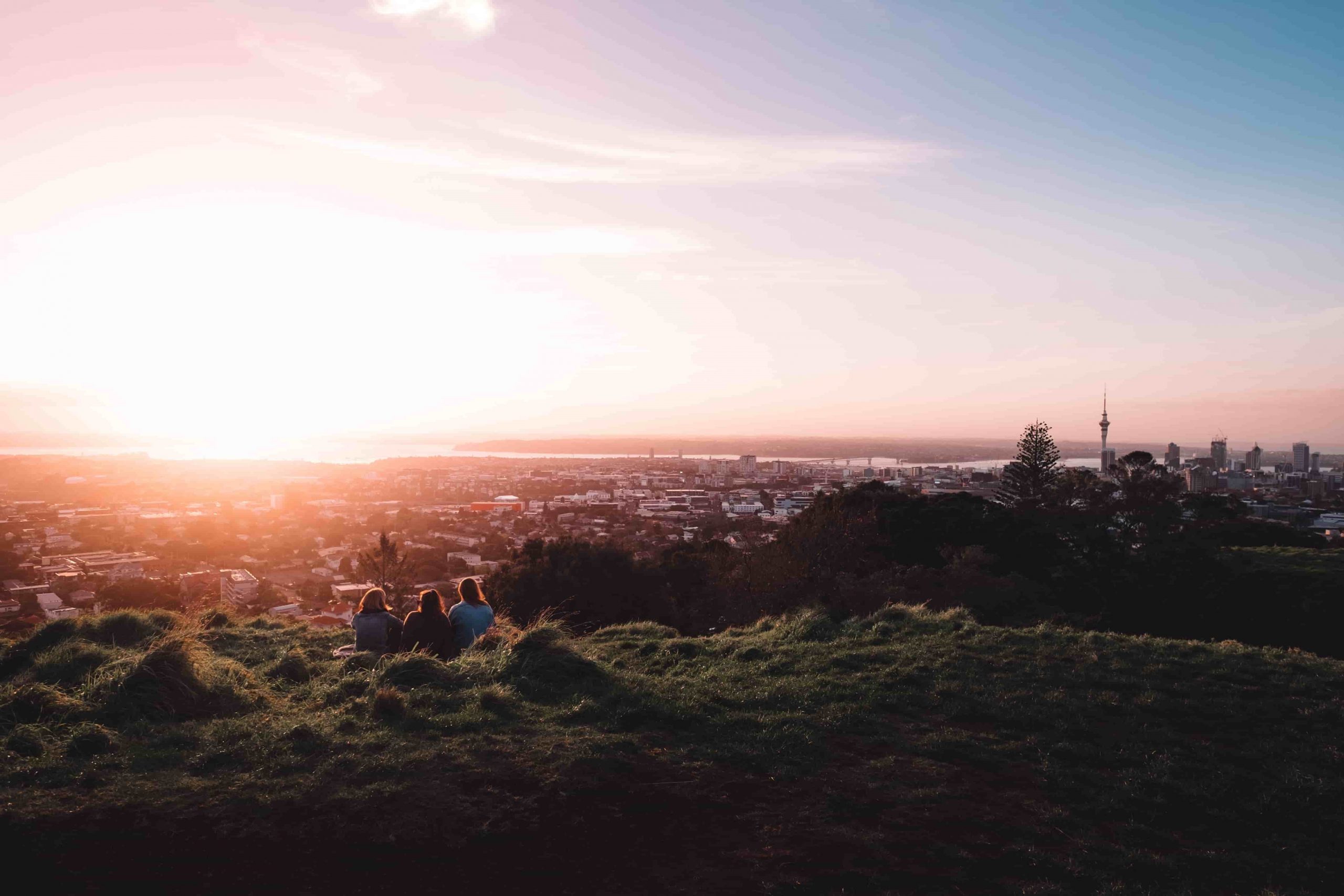 View of Auckland skyline from Mt Eden with sunset in background.