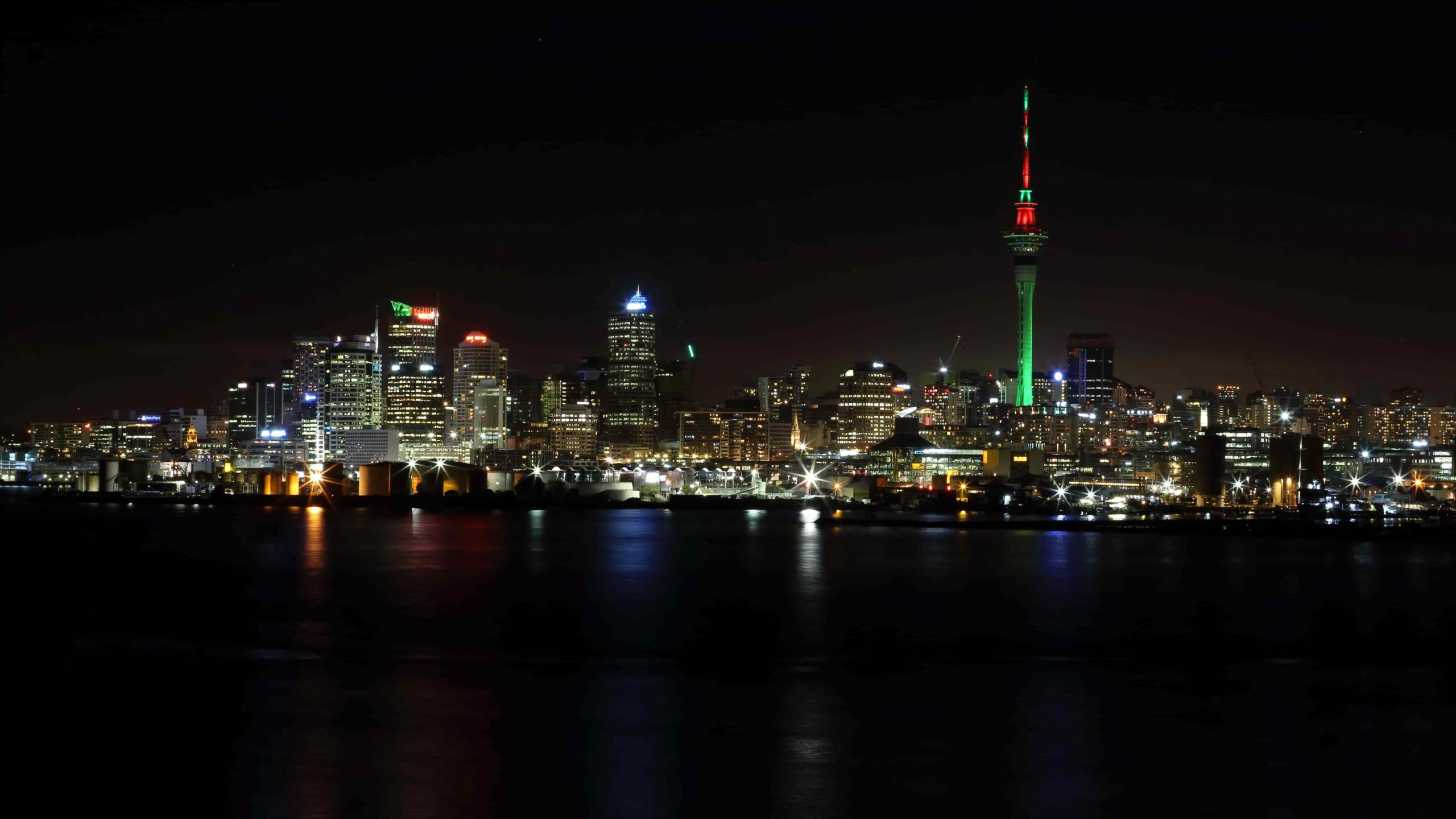 Auckland city skyline at night with shining lights.