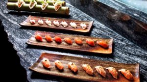 sushi arranged on wooden plates